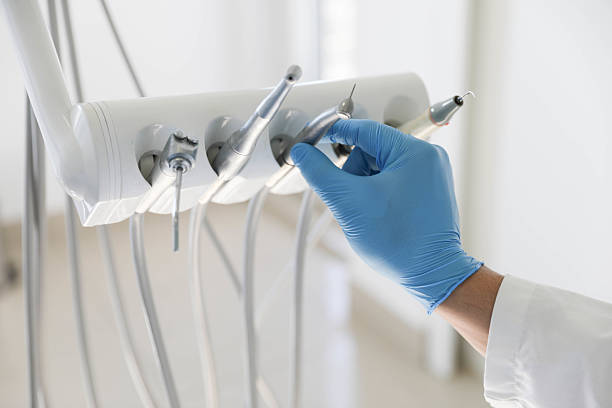 Professional Tooth Extraction technician working in Eaton County County, MI